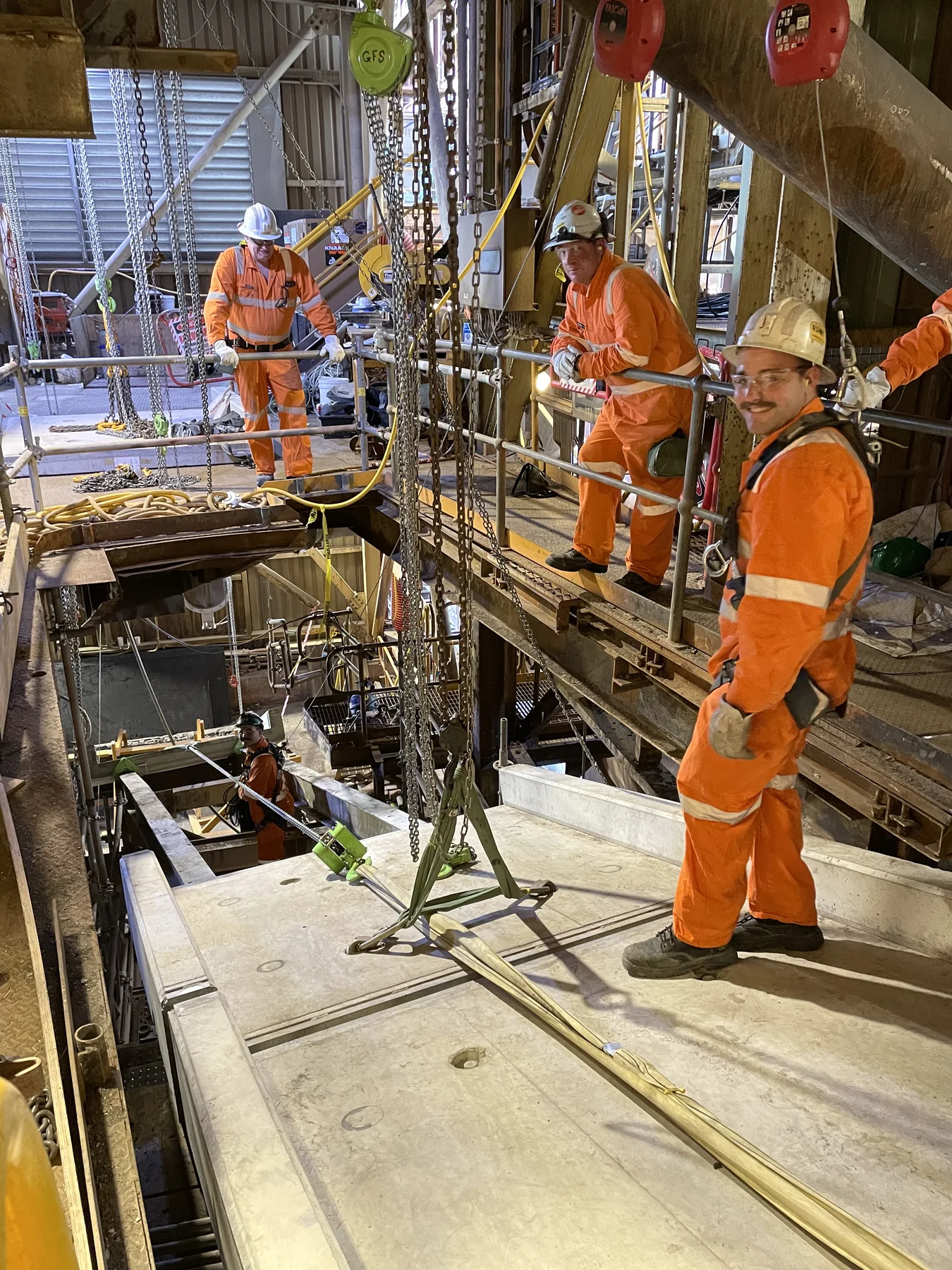 Specialist field team working around industrial structures